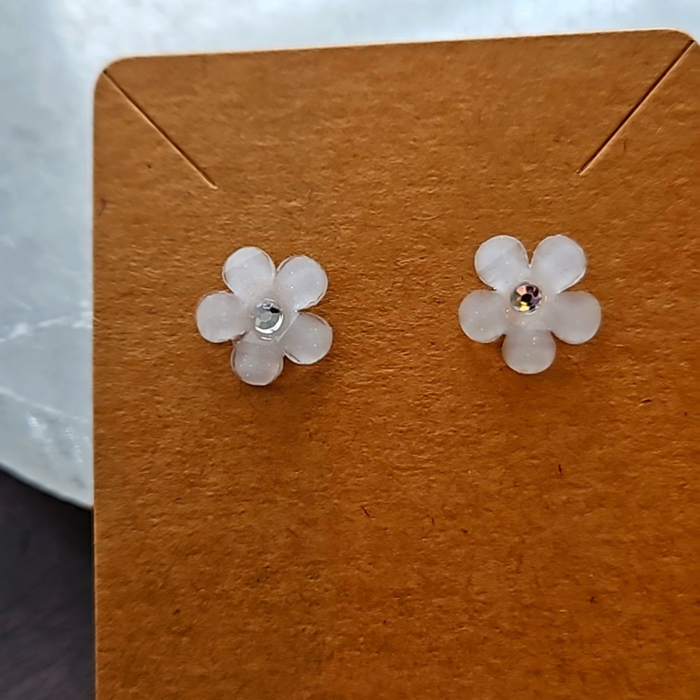 White flower stud earrings with rhinestone center